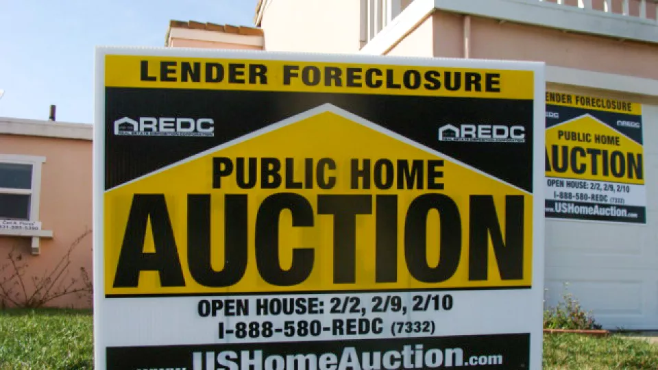 A forclosure sign outside a house.