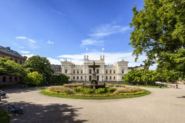 a white building in a park.