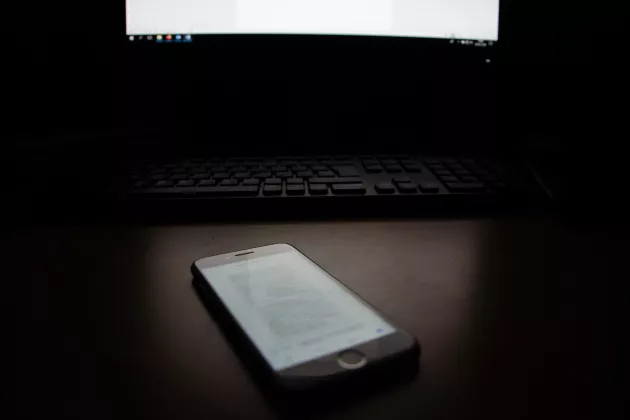 Phone in front of computer