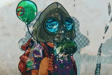 Graffiti painting of a child with a gas mask